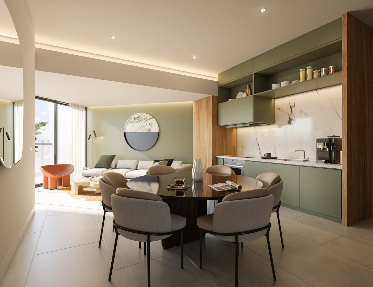 Comedor redondo junto a la cocina verde y la sala de una residencia