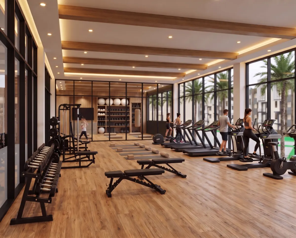 Gimnasio con máquinas y ventanales